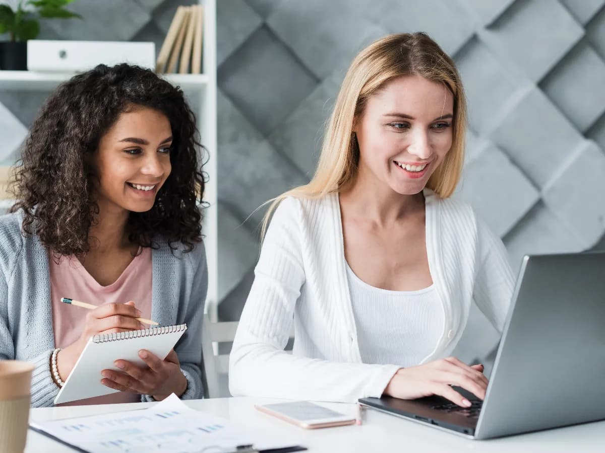 multiracial-employees-working-laptop